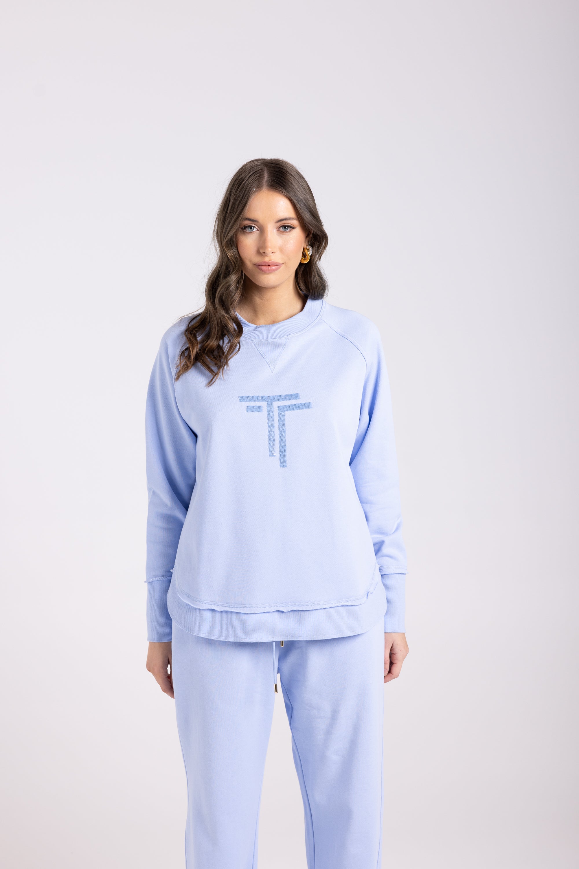 Two-T's Sequin Logo Scoop Hem Sweat - Powder Blue