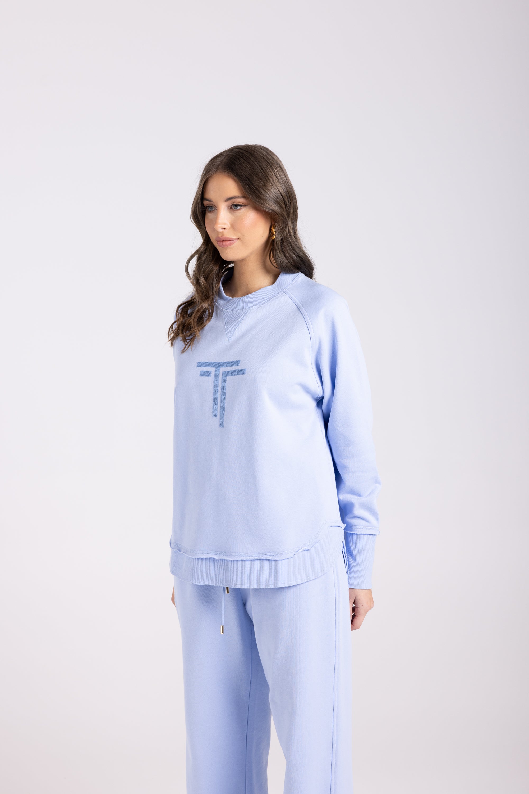 Two-T's Sequin Logo Scoop Hem Sweat - Powder Blue